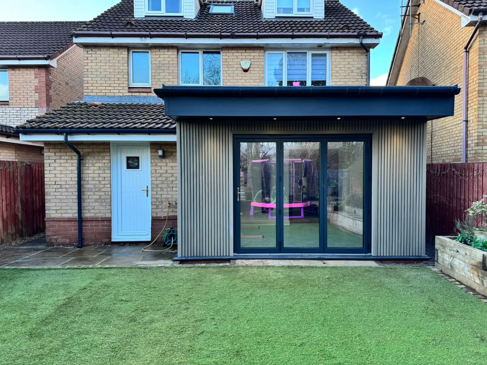 Rear extension with slatted cladding and bifold doors in Cardiff — All Aspects Construction