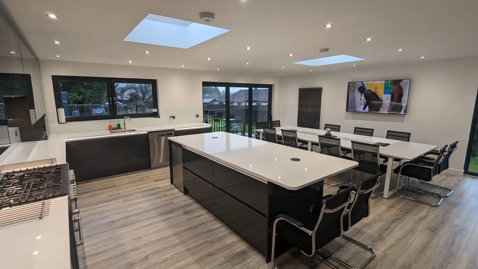 Open-plan kitchen and dining extension with roof lanterns in Cardiff — All Aspects Construction
