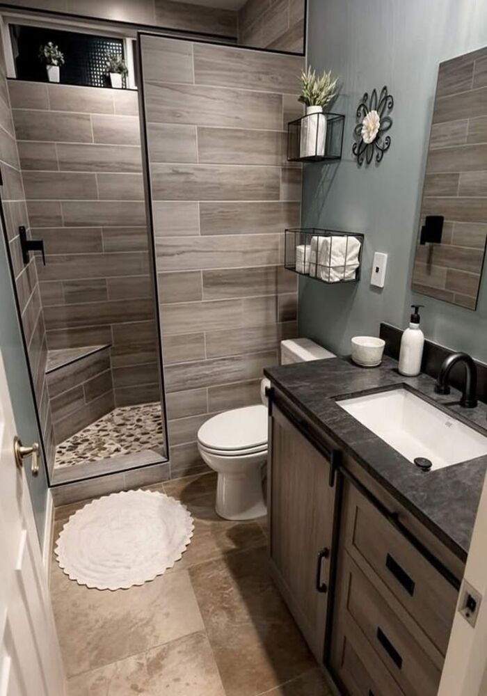 Modern dark-tiled bathroom — All Aspects Construction, Cardiff