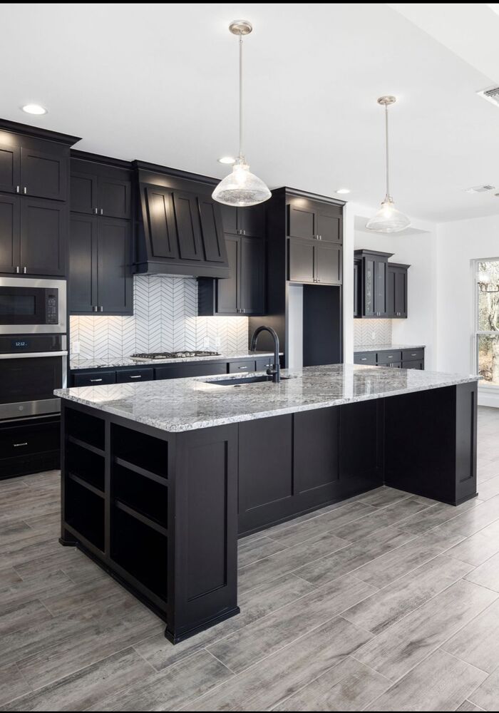 Contemporary black kitchen with island — All Aspects Construction, Cardiff