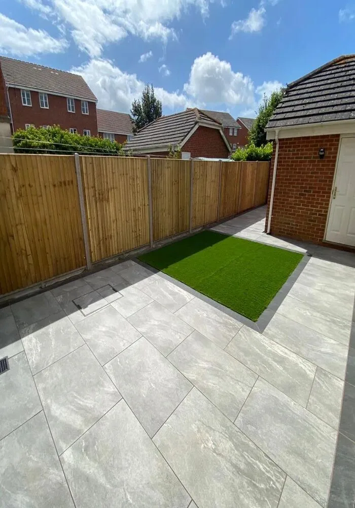 Paved garden patio with lawn and fencing — All Aspects Construction, Cardiff