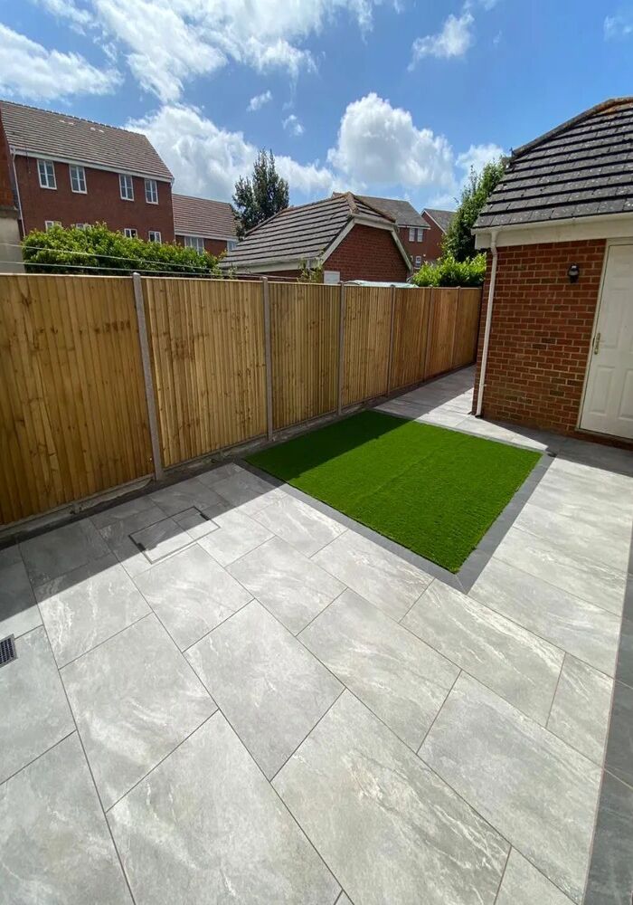 Paved garden patio with lawn and fencing — All Aspects Construction, Cardiff